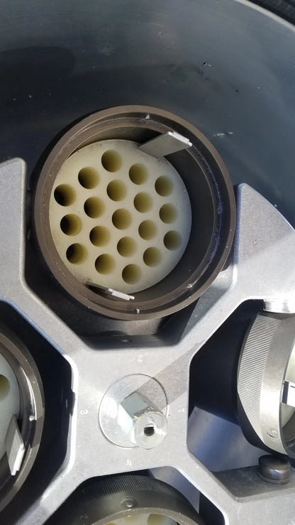 The beige circular connector with multiple holes on the back of the silent solution silencer 2310 centrifuge system for medical equipment