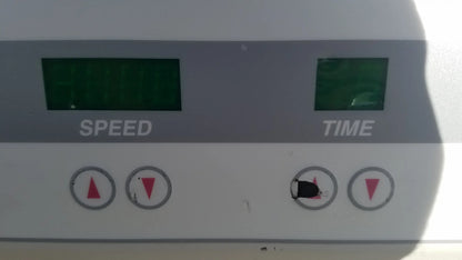 White digital control panel with green lcd screens and red buttons on the silent solution silencer 2310 centrifuge system for medical equipment reuse