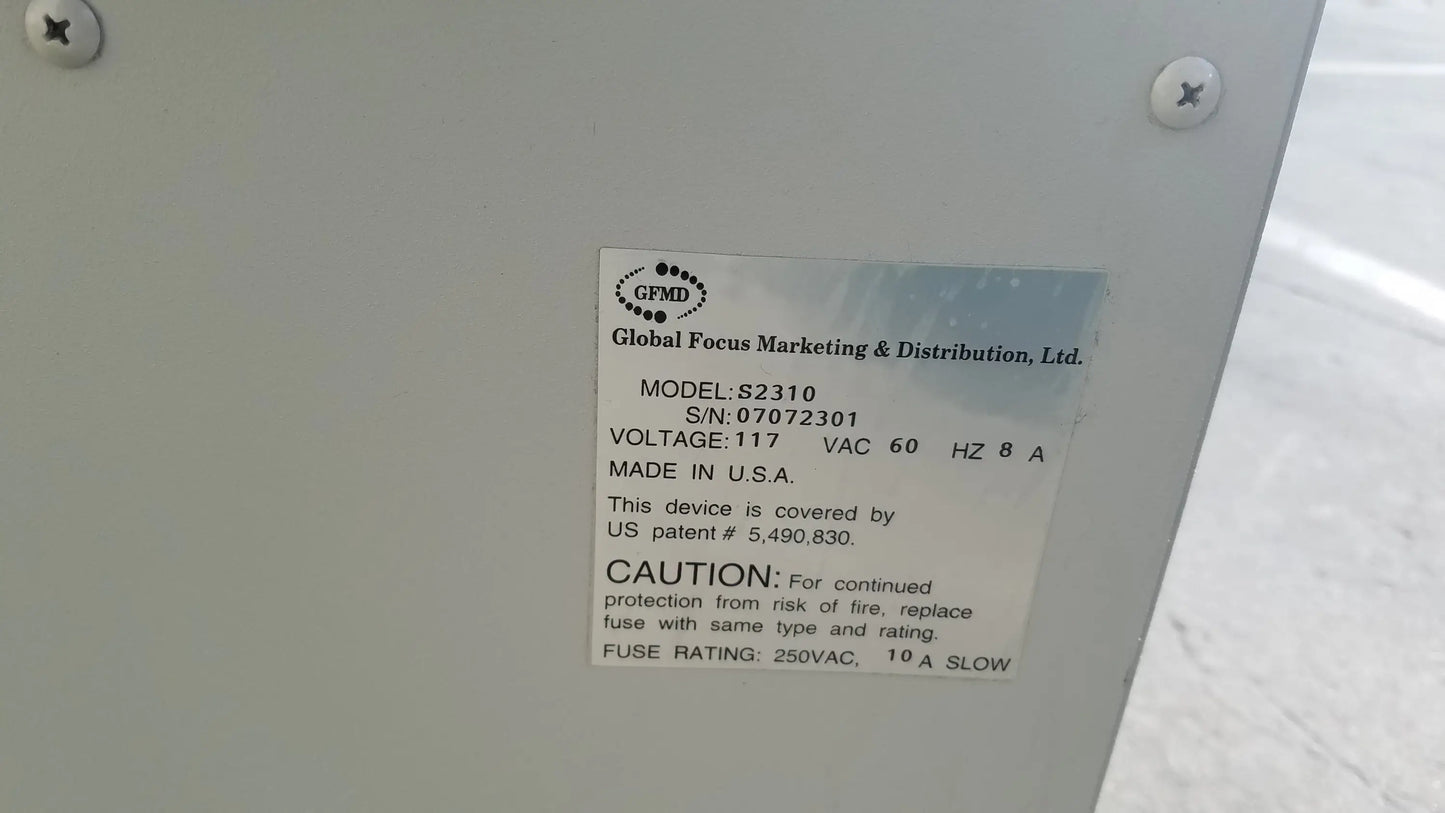 White plastic label on the back of the silent solution silencer 2310 centrifuge system showing medical equipment specs