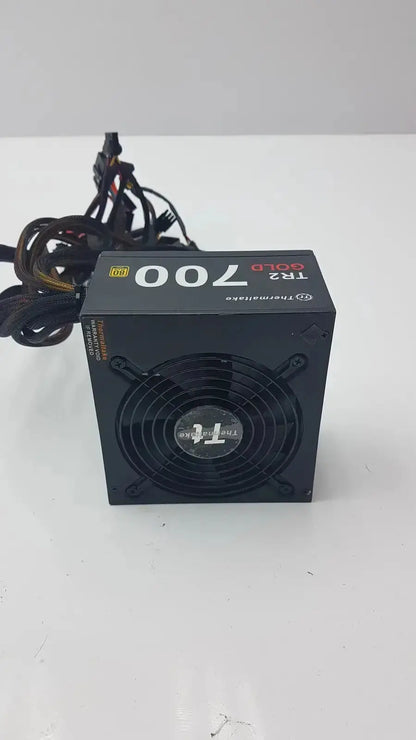 Black thermaltake tr2 700w atx 12v power supply unit with circular fan and bundled cables for desktop PC use