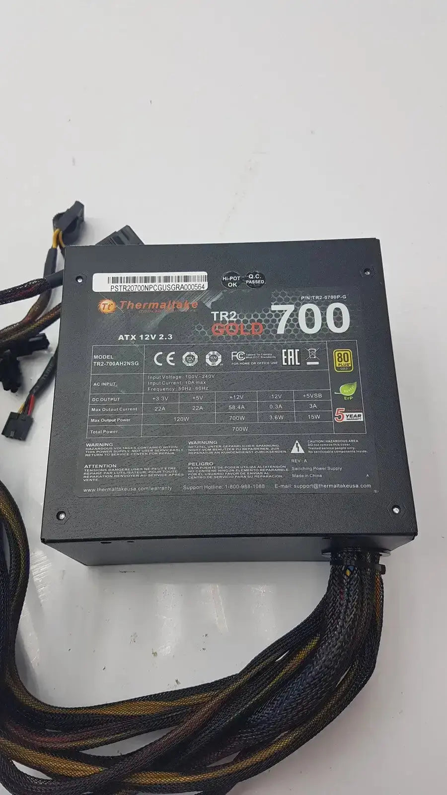 Black thermaltake tr2 700w atx 12v power supply unit with gold certification and multiple cables for desktop PC use