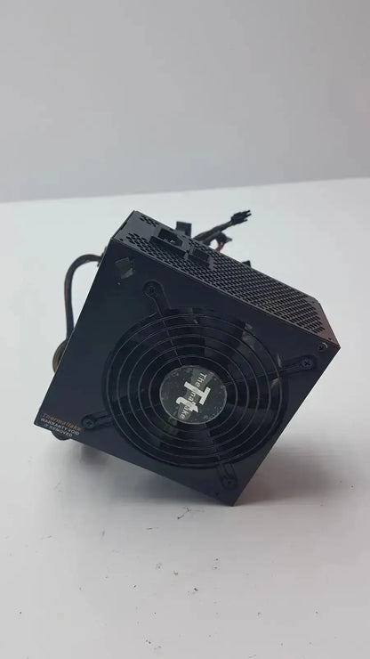Black thermaltake tr2 700w atx 12v power supply unit with fan and ventilation grilles for desktop pcs