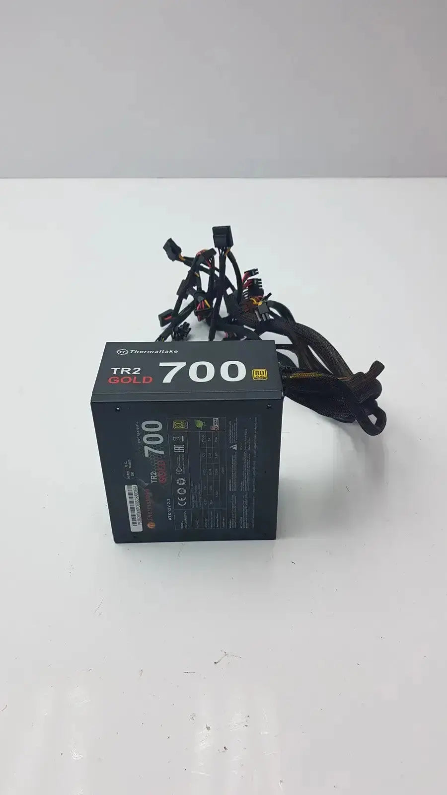 Black thermaltake tr2 700w atx 12v 2.3 power supply unit with 80 plus gold certification and bundled cables