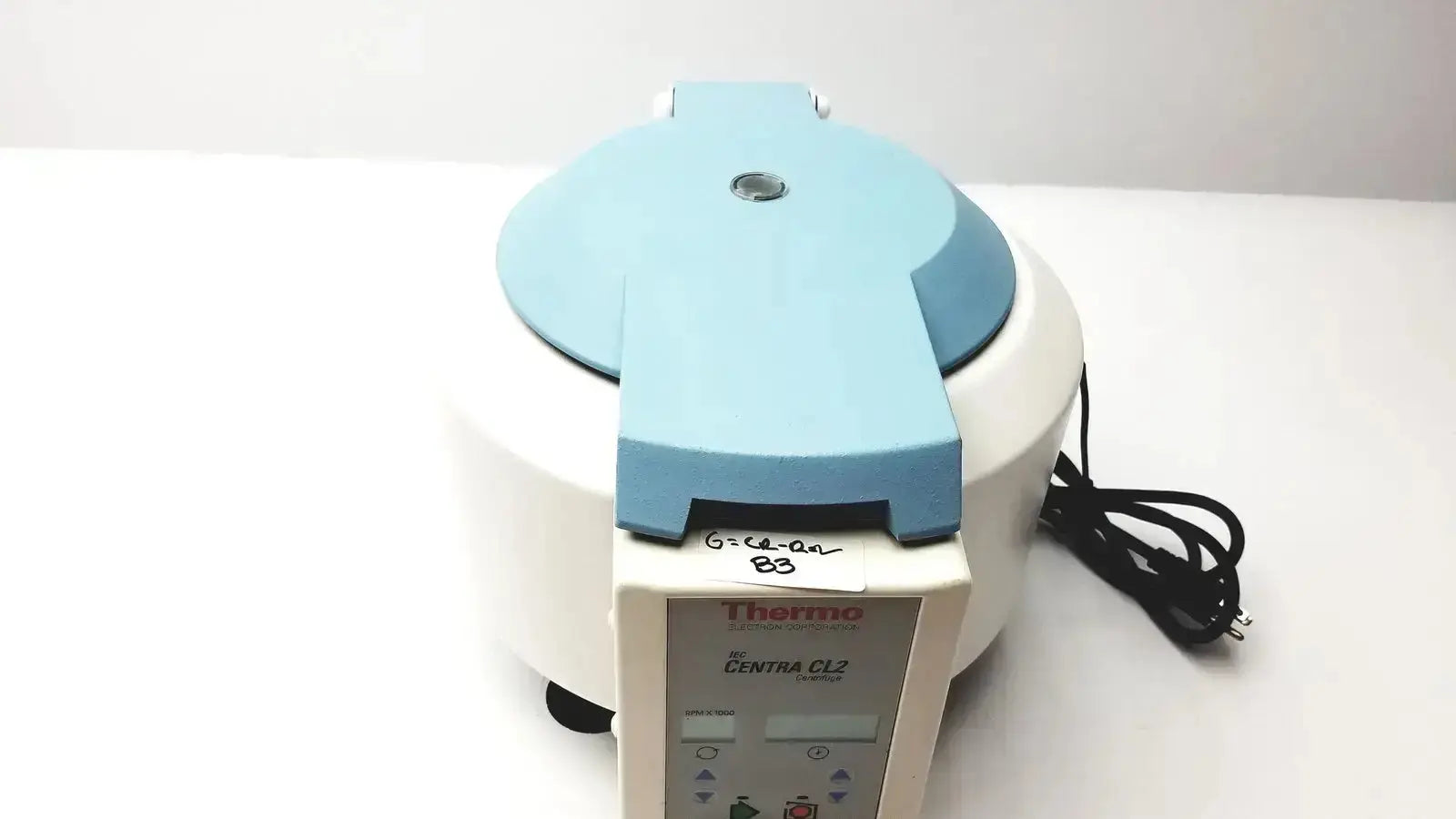 Thermo Electron Corporation iec centra cl2 centrifuge with a light blue lid and white body for laboratory use
