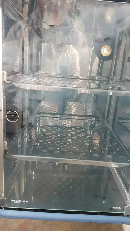 Stainless steel thermo scientific heratherm igs60 incubator with multi-tiered perforated shelves and glass doors