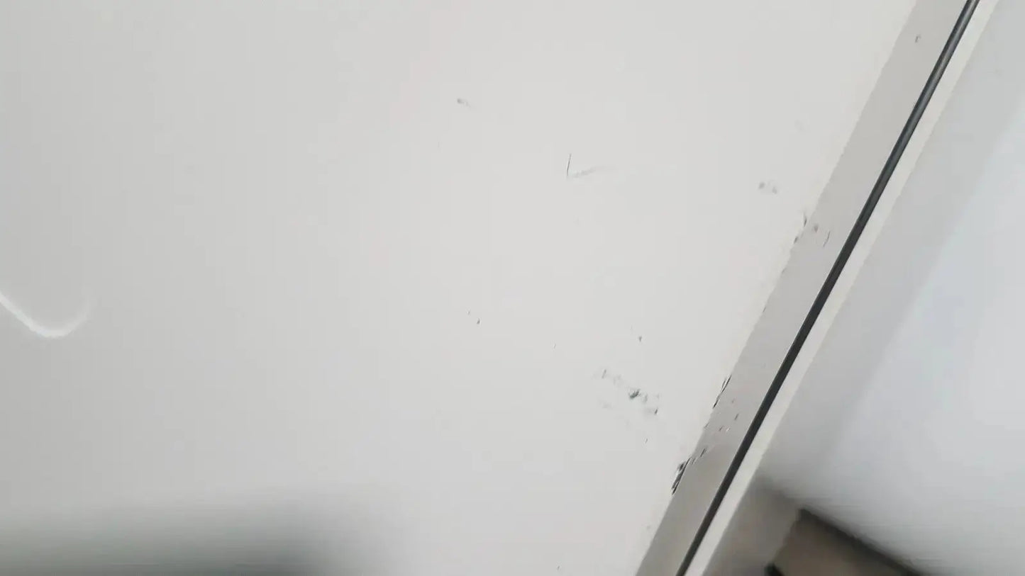White wall with minor scuffs and a dark vertical trim line behind the thermo scientific heratherm igs60 incubator
