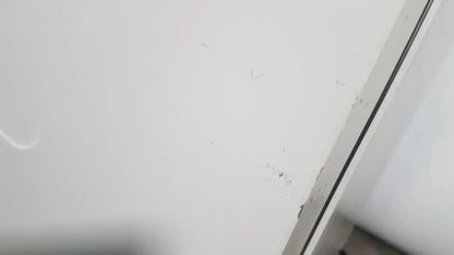 White wall with minor scuffs and a dark vertical trim line behind the thermo scientific heratherm igs60 incubator
