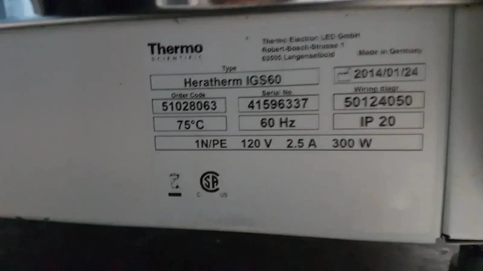 White rectangular label with black text showing specifications for thermo scientific heratherm igs60 incubator heating device
