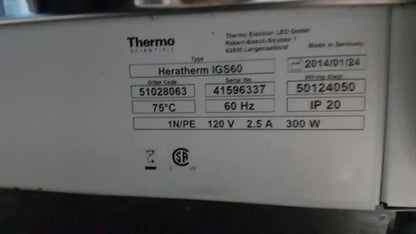 White rectangular label with black text showing specifications for thermo scientific heratherm igs60 incubator heating device