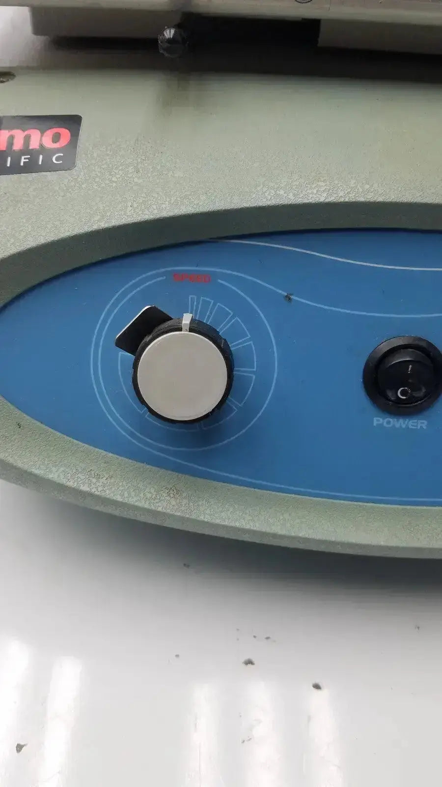 Blue control panel with silver knob and black power switch on gray thermo scientific maxq 2500 orbital reciprocating shaker
