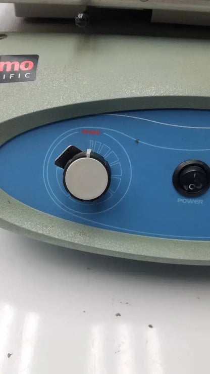 Blue control panel with silver knob and black power switch on gray thermo scientific maxq 2500 orbital reciprocating shaker