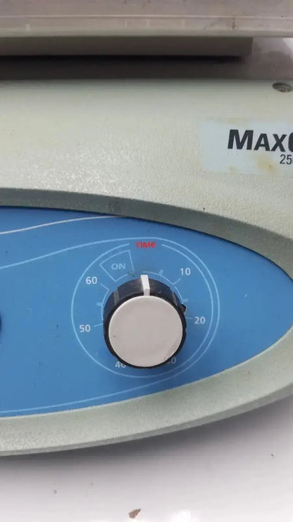 Beige and blue thermo scientific maxq 2500 orbital reciprocating shaker with white dial marked 0 to 60 for time control