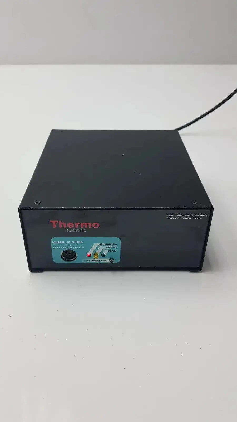 Black thermo scientific miran sapphire charger model 5025a with teal control panel and labeled milan sapphire 102 ports