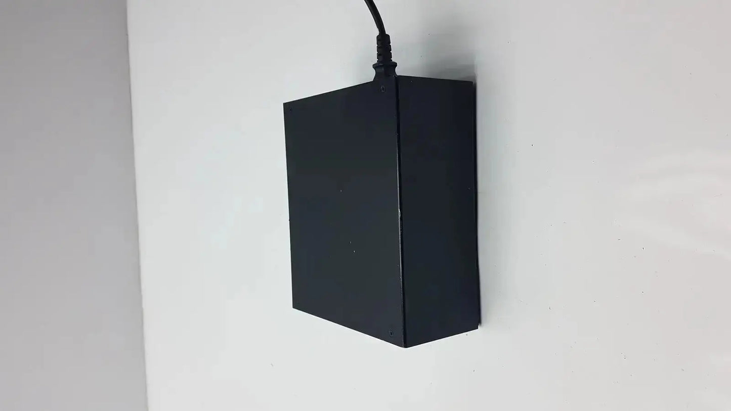 Black rectangular thermo scientific miran sapphire charger model 5025a with black cord extending from top
