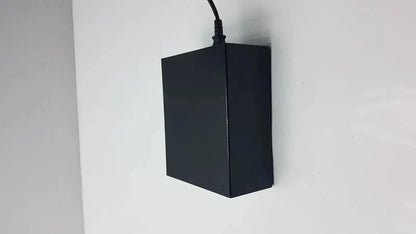 Black rectangular thermo scientific miran sapphire charger model 5025a with black cord extending from top