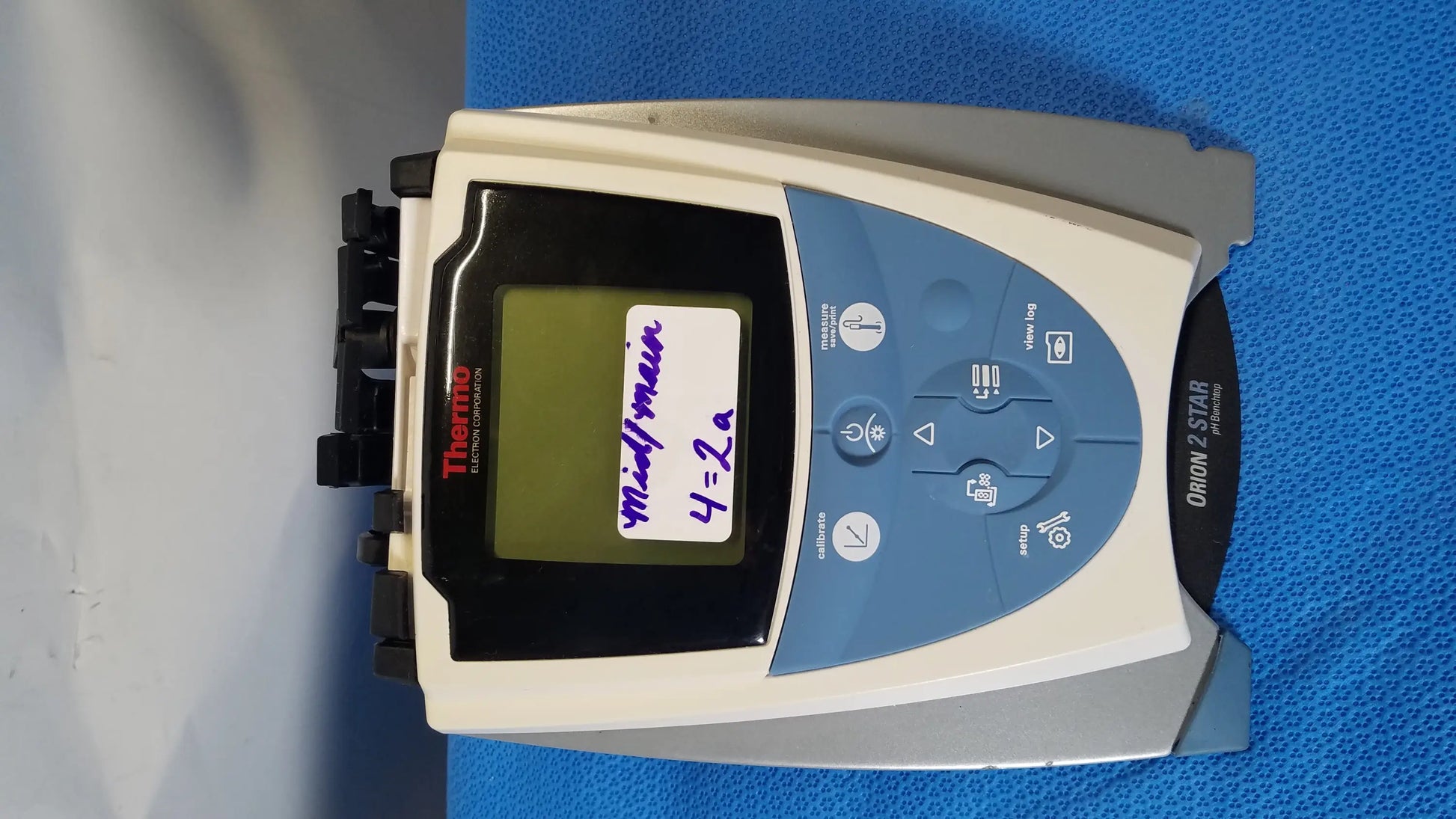 Thermo scientific orion 2 star benchtop meter with beige and blue plastic casing and black screen displaying notes in medical equipment use