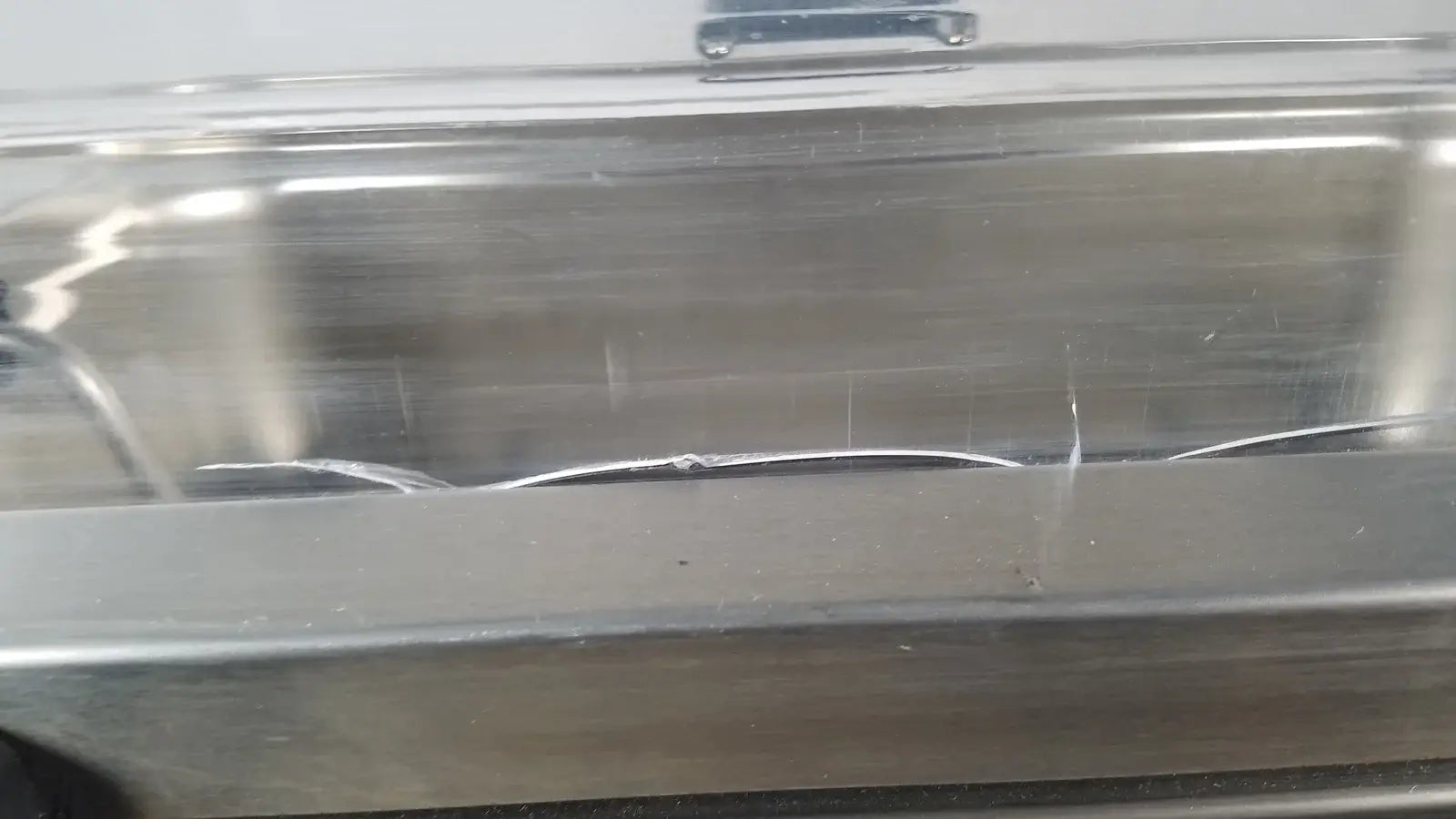 Clear plastic container with metallic silver lid and scratches featured in thermo scientific swb25 digital shaker medical equipment