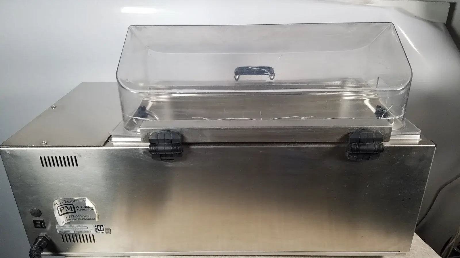 Stainless steel commercial food vacuum sealer with clear plastic lid and black latches for thermo scientific swb25 medical equipment