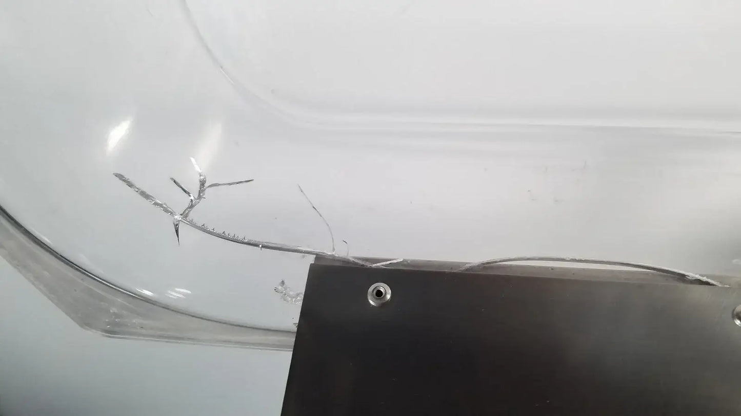 A transparent cracked plastic container of thermo scientific swb25 digital shaker water bath used in medical equipment
