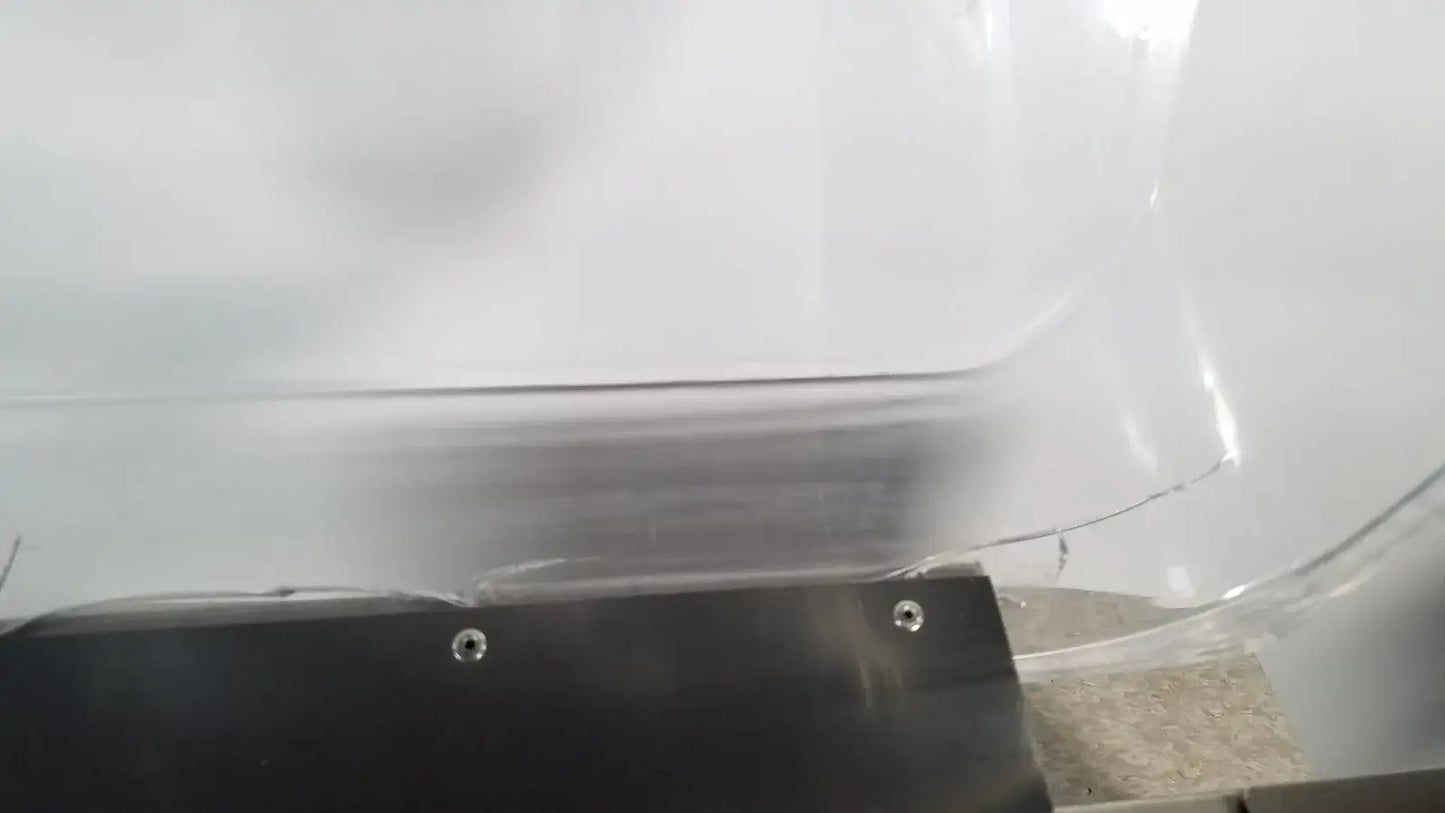 Clear plastic windshield with black metal bracket and silver screws on thermo scientific swb25 digital shaker medical equipment