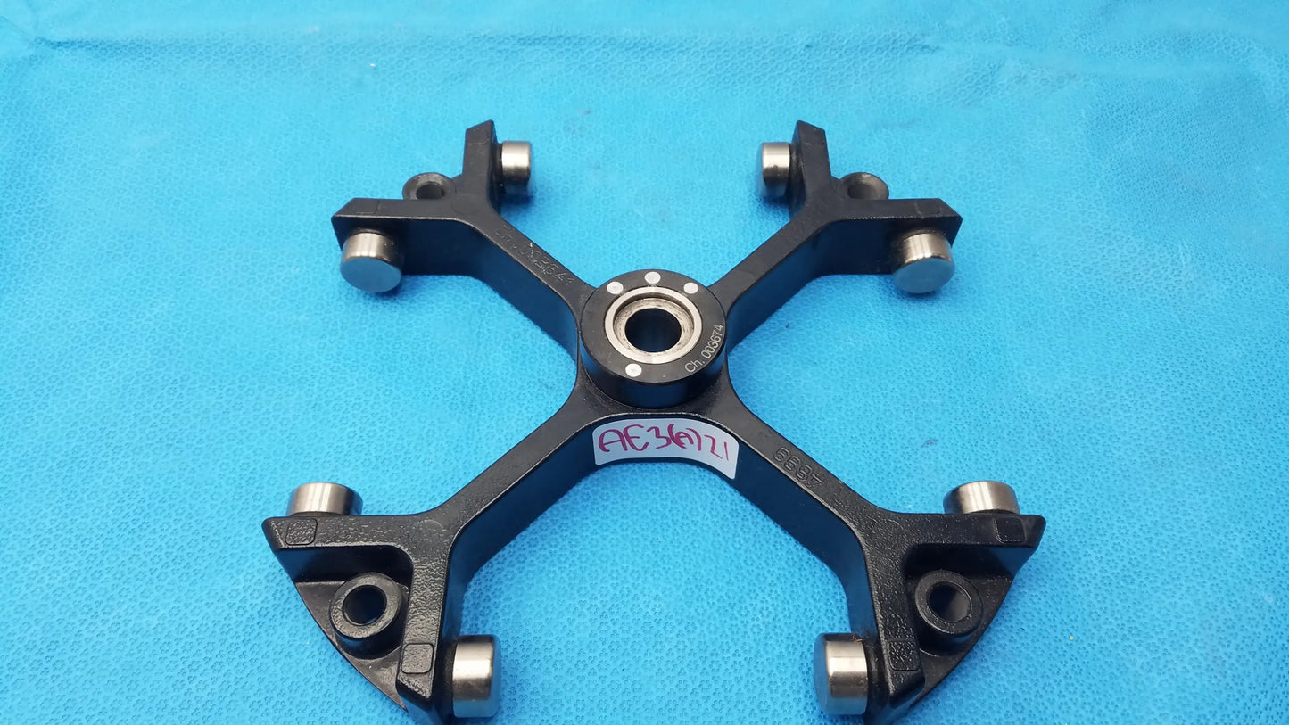 Black metal bicycle wheel hub with silver bearings and central bearing housing for reuse medical equipment use