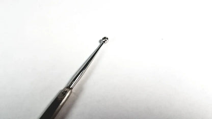 Silver-toned stainless steel tiemann surgical dermal curette size 4 with slender handle and small spherical tip medical equipment