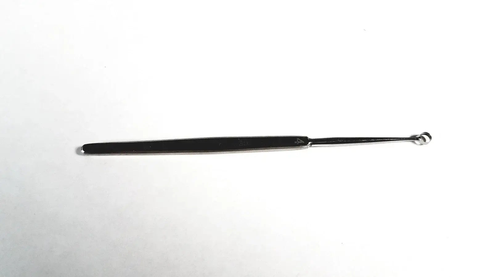 Black-handled tiemann surgical dermal curette size 4 with slender stainless steel tip medical equipment instrument