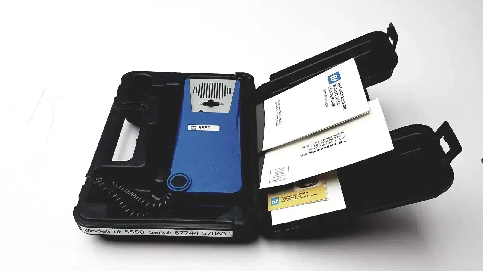 Blue tif 5550 halogen leak detector in black carrying case for detecting halogen leaks with manual included