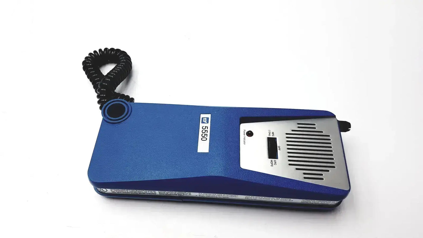 Blue handheld tif 5550a automatic halogen leak detector with silver control panel and coiled black cord for halogen leak detection