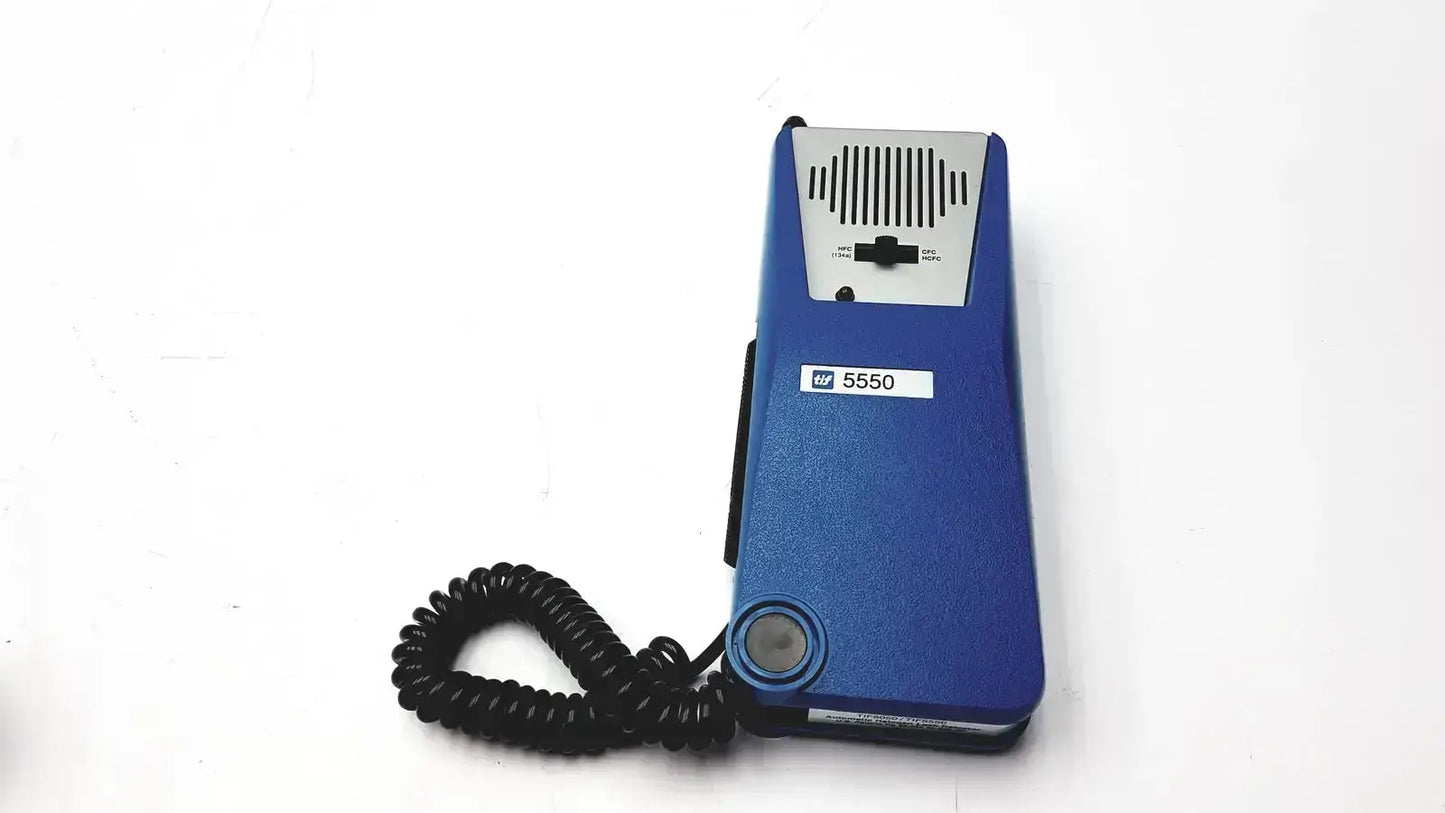 Blue hp 5550 corded telephone with silver speaker grille and black coiled handset in tif 5550a halogen leak detector case manual