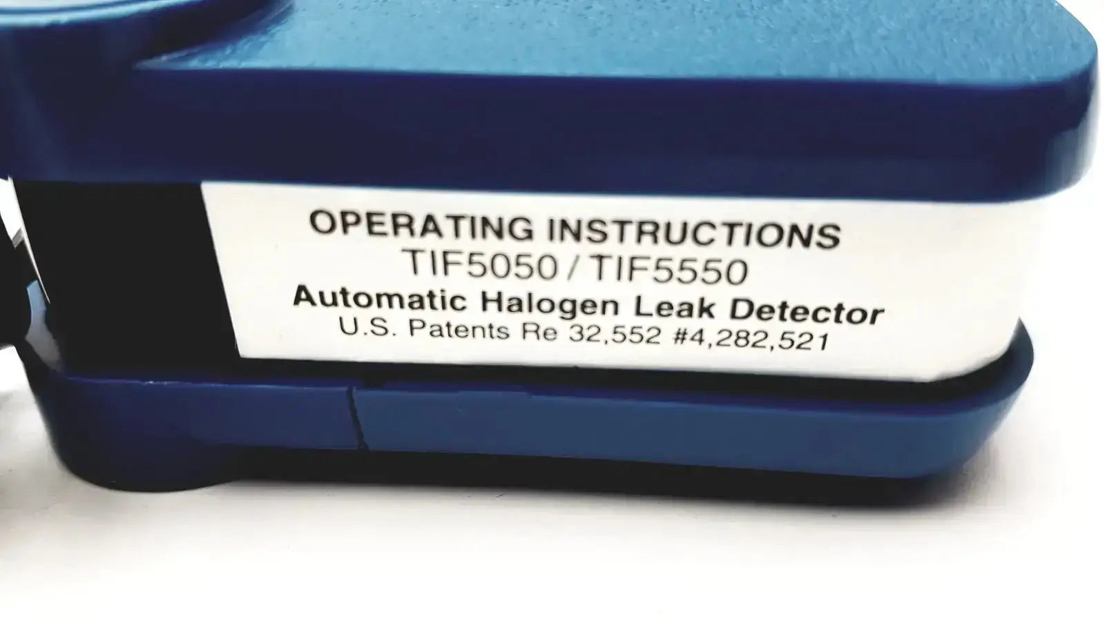 Blue plastic tif 5550a automatic halogen leak detector with white label showing model numbers and patent information