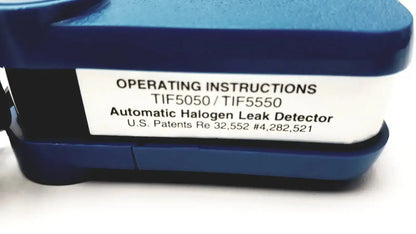Blue plastic tif 5550a automatic halogen leak detector with white label showing model numbers and patent information