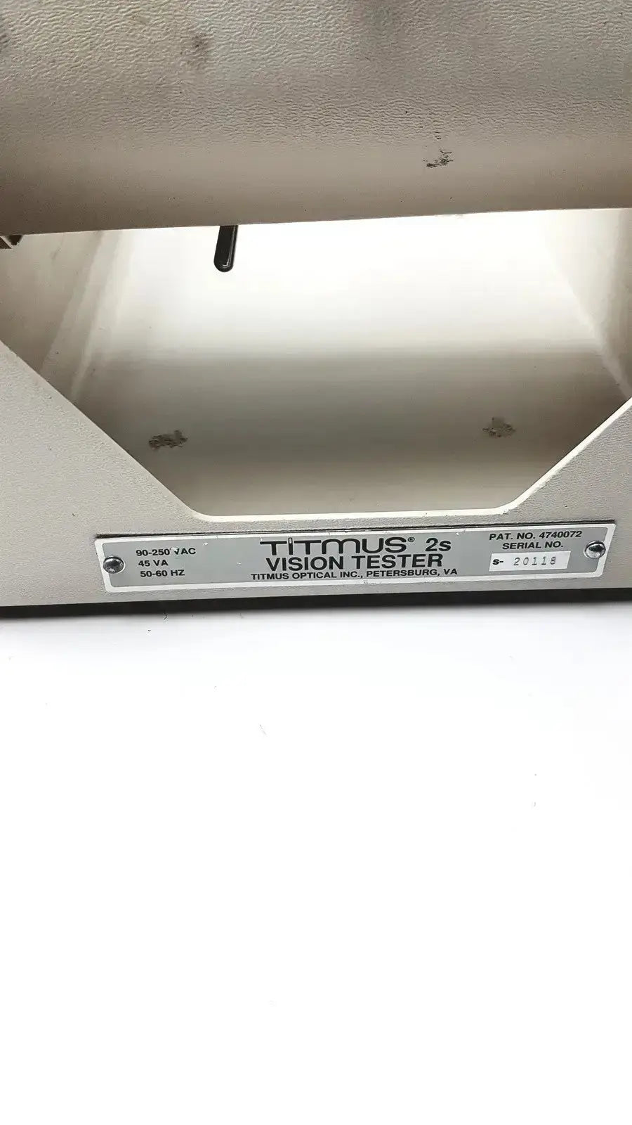 Silver metallic tittmus 2s optical ii vision tester with sleek industrial design and engraved titmus optical labeling