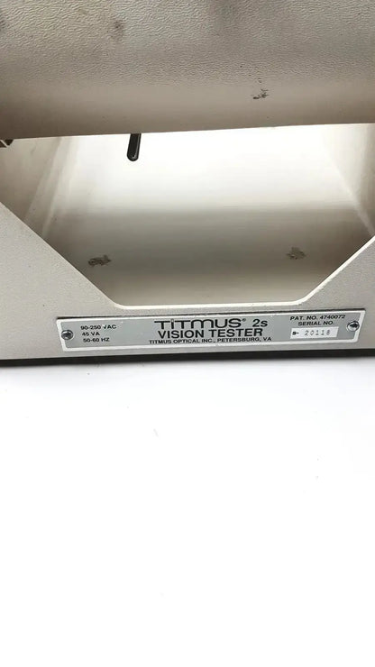 Silver metallic tittmus 2s optical ii vision tester with sleek industrial design and engraved titmus optical labeling