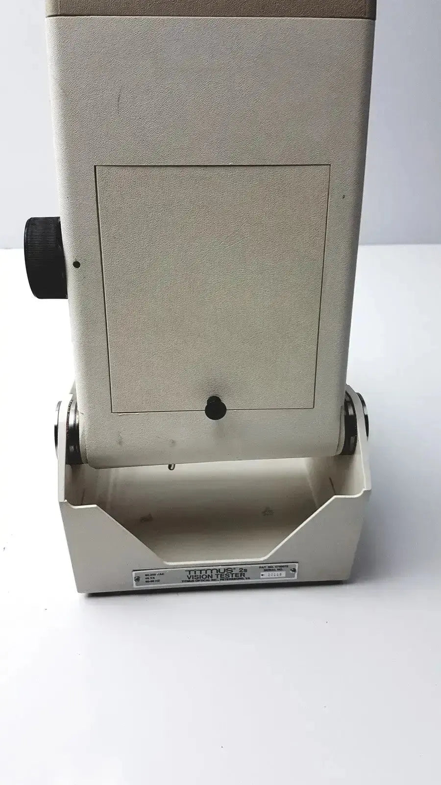 Beige rectangular titmus optical ii vision tester with black side knob and japan label for eye examination use