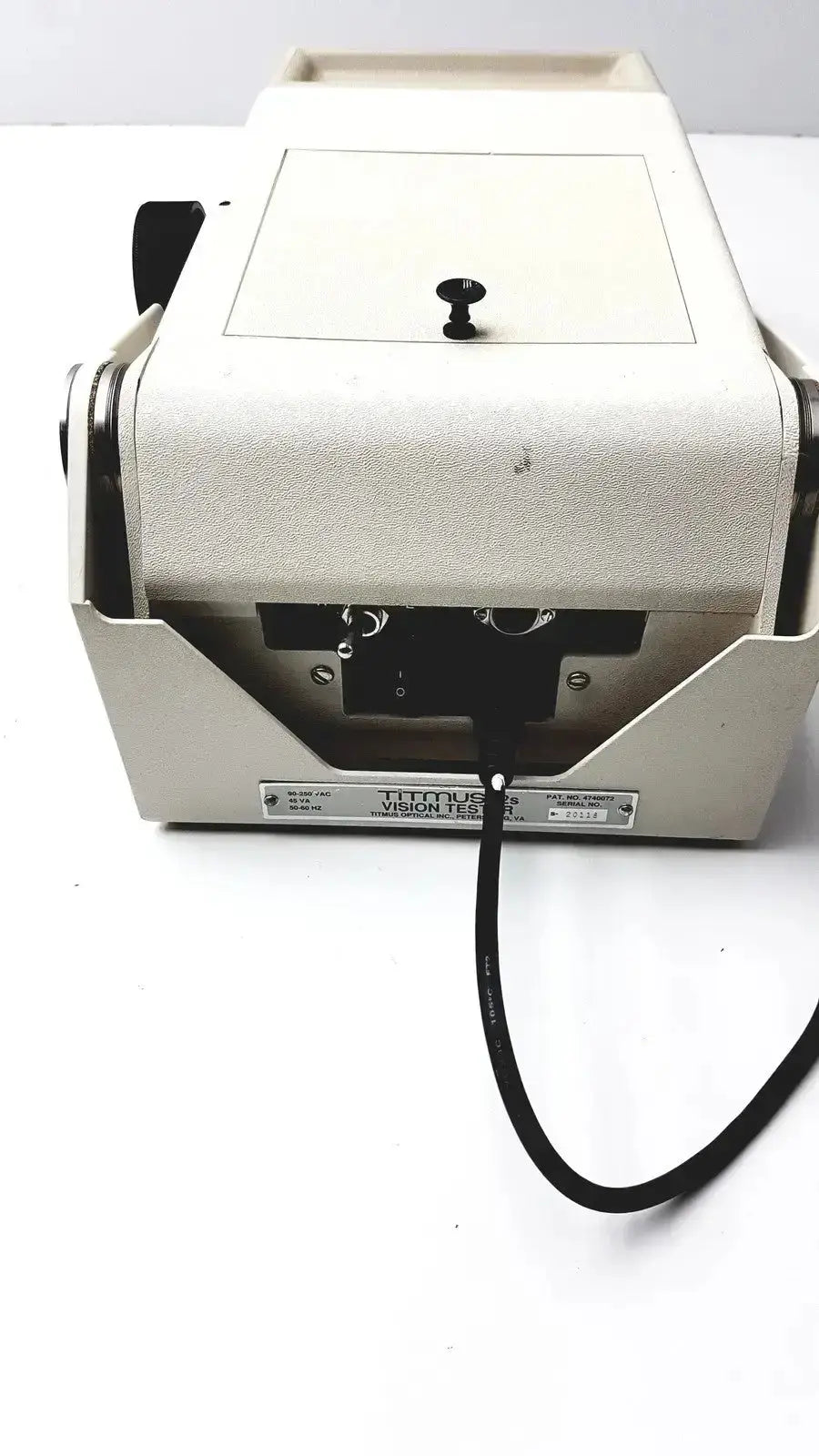 Beige titmus optical ii vision tester machine with black power cord and control knob for accurate eye examination