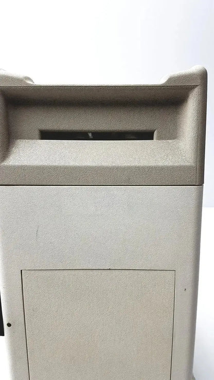 Beige textured outdoor trash can with rectangular slot and hinged door for titmus optical ii vision tester use