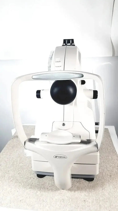 White toricorn slit lamp biomicroscope with black circular lens and silver accents in topcon trc-nw8 retinal camera for sale