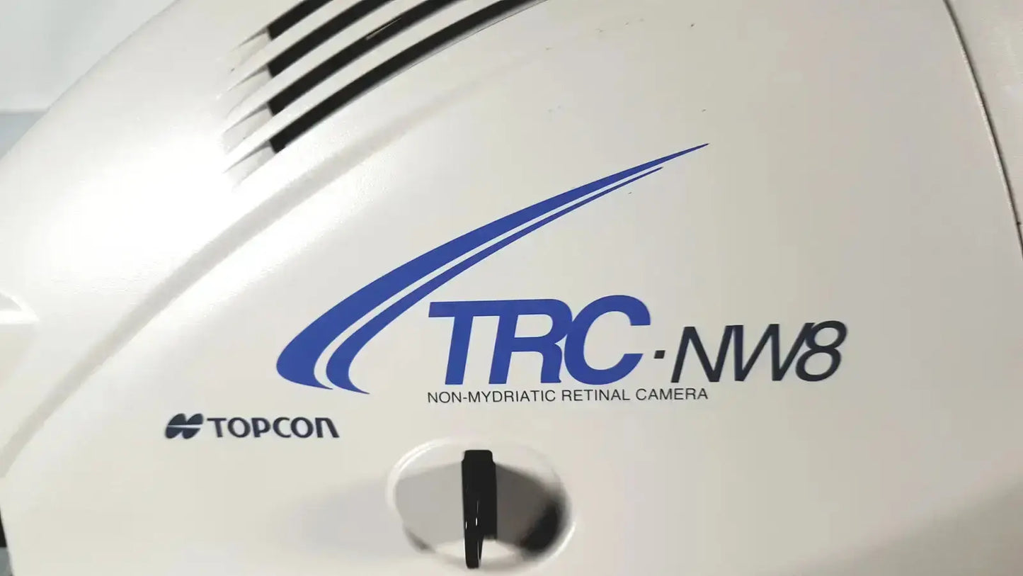 White Topcon TRC-NW8 non mydriatic retinal camera with blue logo and black ventilation slits used medical equipment for sale