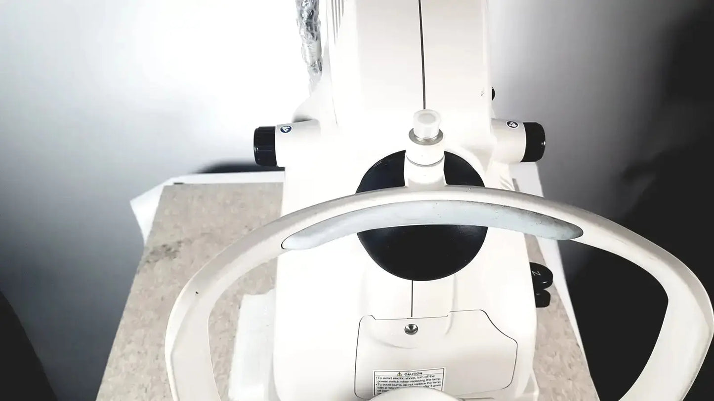 White retinal camera with black accents and curved handle topcon trc-nw8 used medical equipment for sale