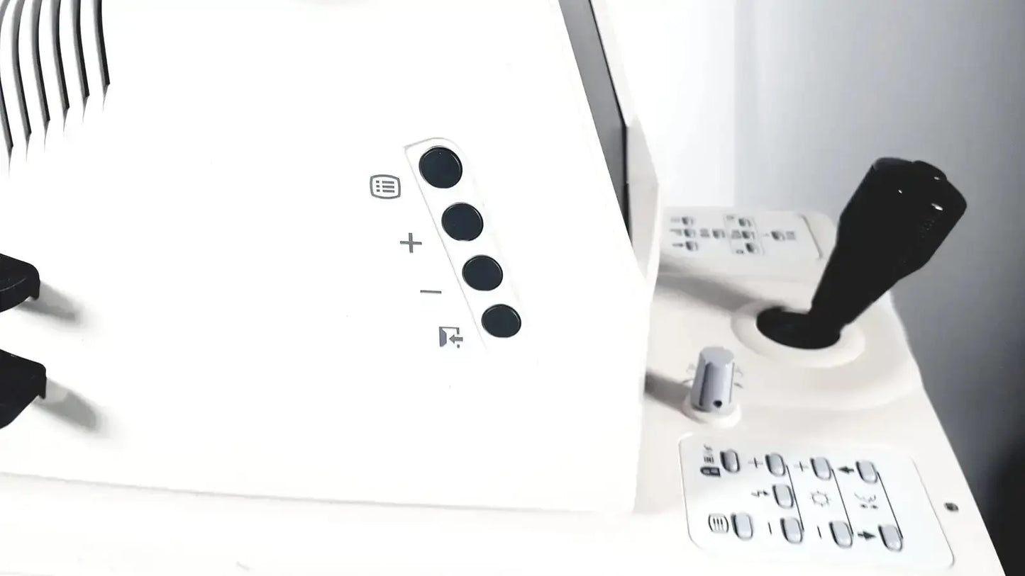 White control panel with black circular buttons and joystick on topcon trc-nw8 retinal camera used medical equipment for sale