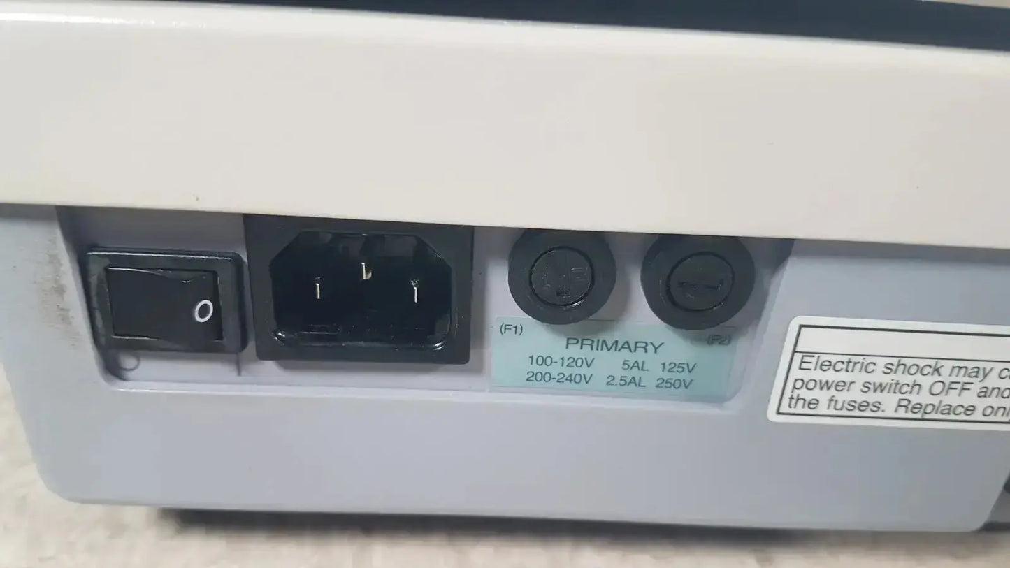 Back side of gray plastic power supply unit with black switch and input sockets for topcon trc-nw8 retinal camera used medical equipment for sale