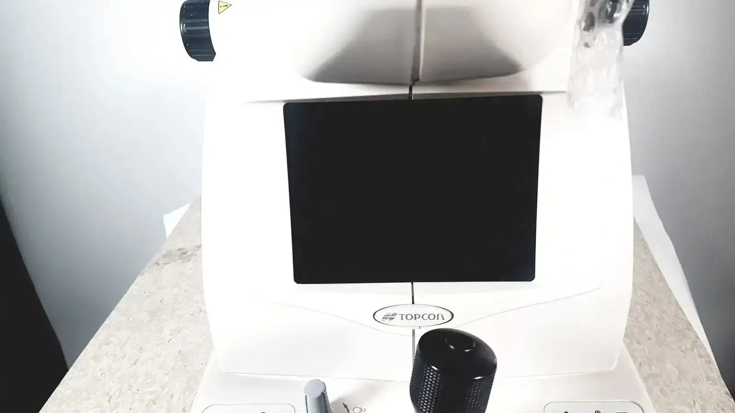 White topcon trc-nw8 retinal camera with black screen and textured knobs used medical equipment for sale
