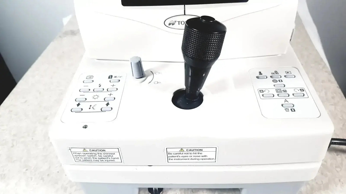 Black textured joystick with matte finish on white control panel of topcon trc-nw8 retinal camera used medical equipment for sale