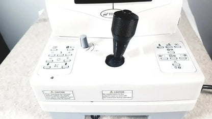Black textured joystick with matte finish on white control panel of topcon trc-nw8 retinal camera used medical equipment for sale