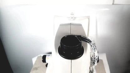 White topcon trc-nw8 retinal camera with black textured focusing knob and clear plastic-coated cable for medical use