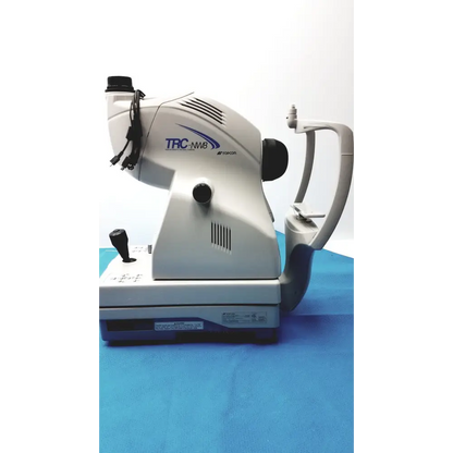 White and gray trc-nm8 slit lamp microscope by topcon, featuring a sleek ergonomic design with black control knobs and a curved arm for precise eye examination.