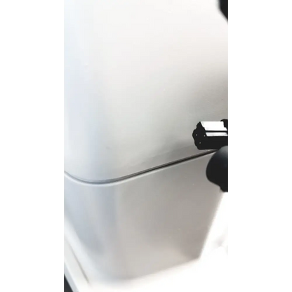 A sleek, minimalist white refrigerator with a smooth finish and a subtle silver handle.