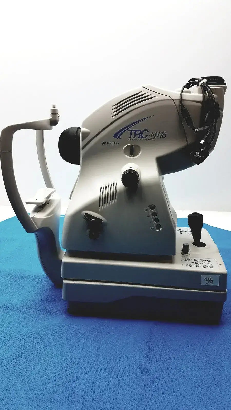Silver and black topcon trc-nw8 slit lamp retinal camera for digital fundus imaging in non-mydriatic use