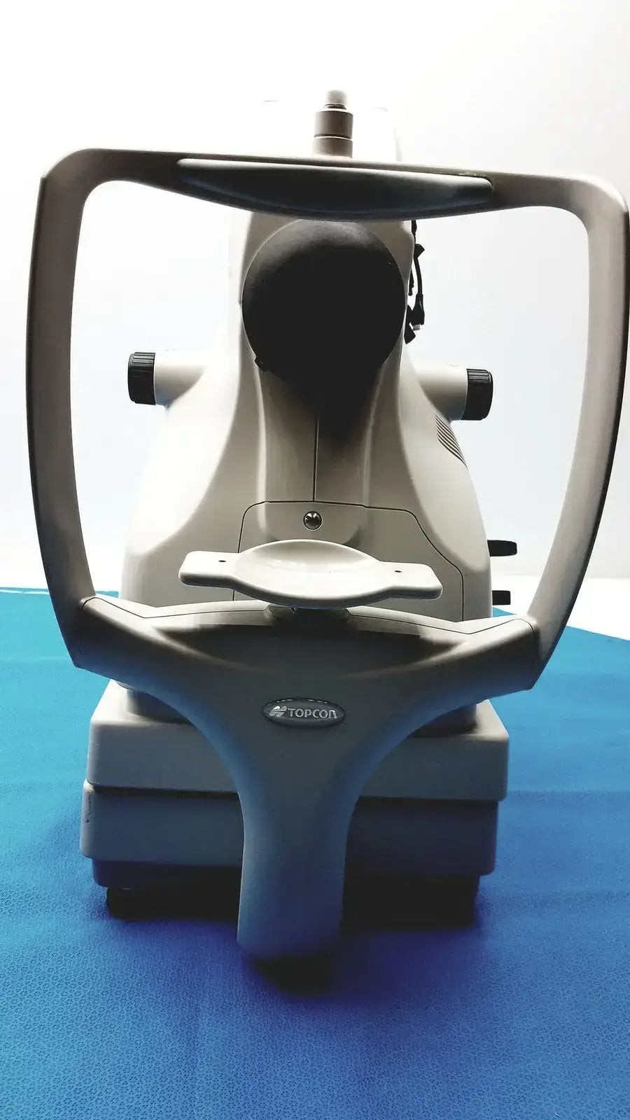 A sleek gray and black topcon trc-nw8 digital fundus imaging retinal camera for non-mydriatic eye examinations